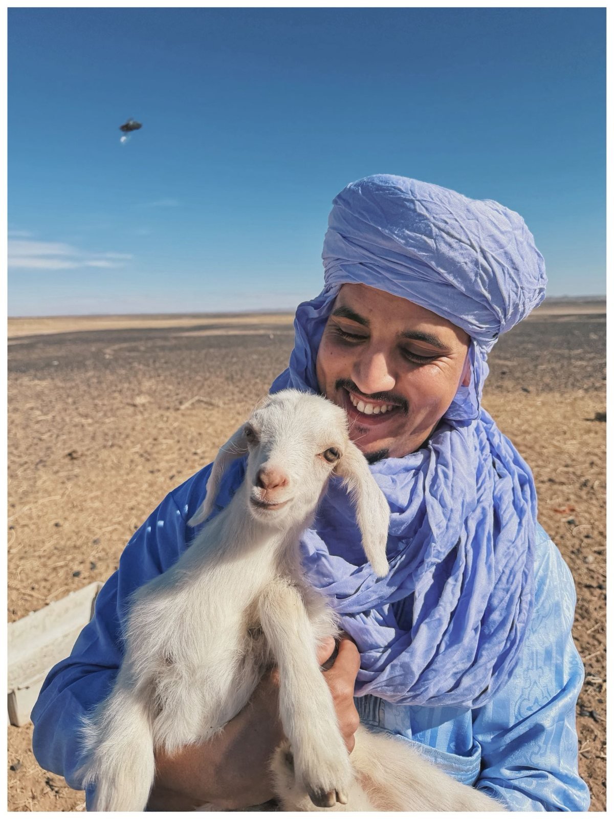 Our guide with a baby goat near Merzouga