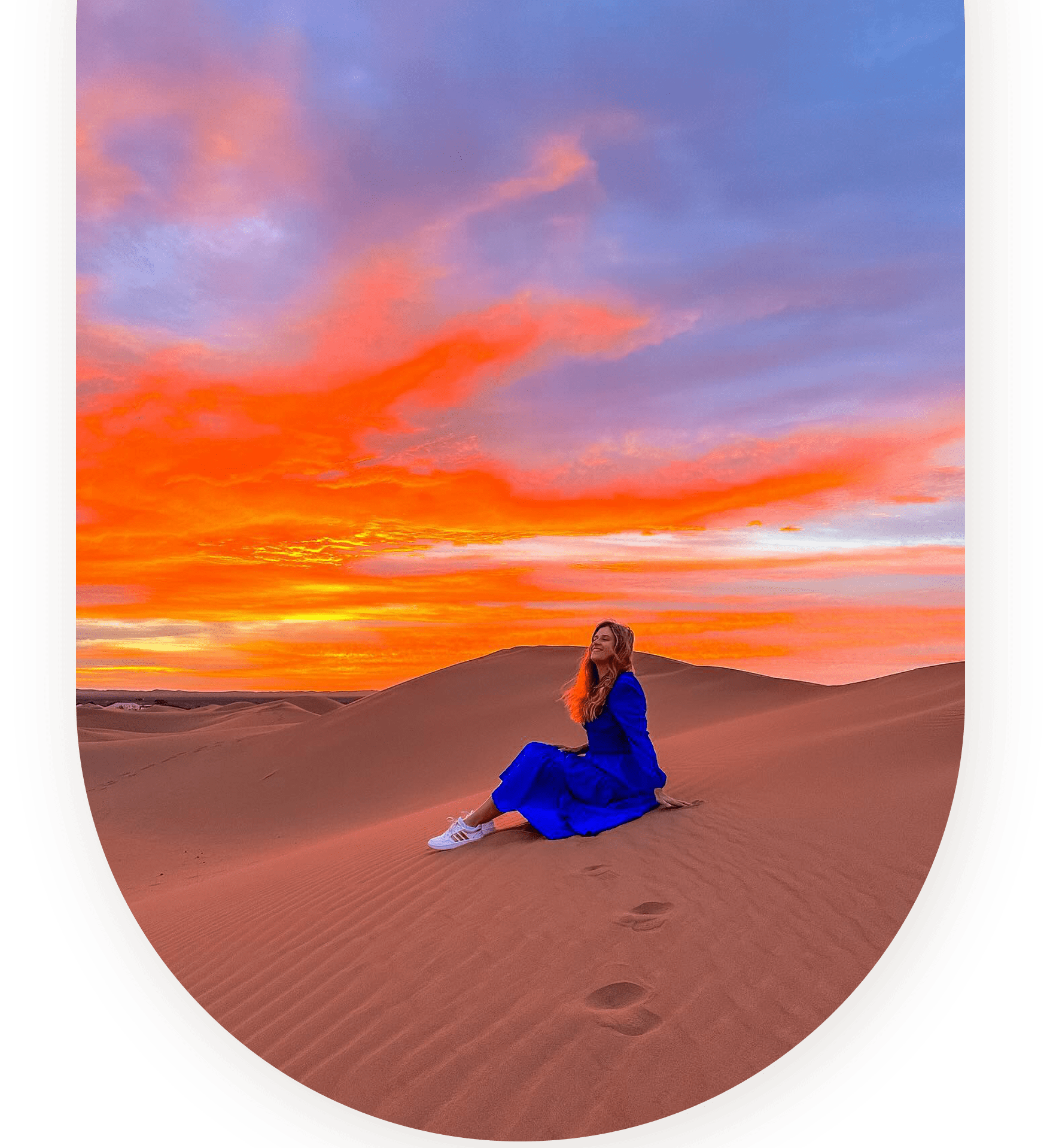 Girl sitting in the Sahara Desert on a Morocco tour with Best Morocco Travel
